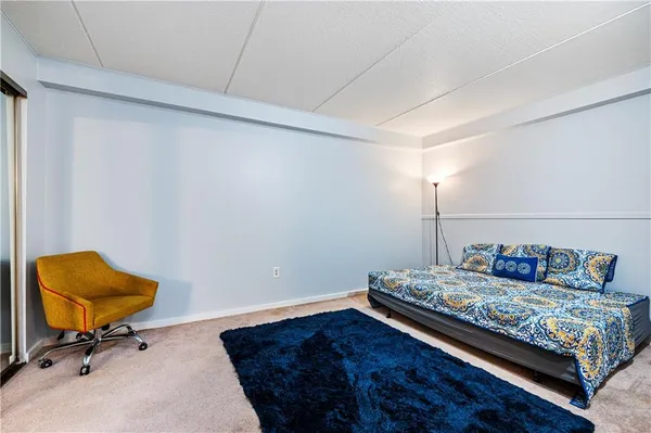 a bed room with a bed and a window