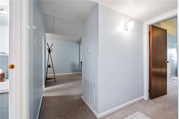 a bedroom with a large bed and a view of bathroom