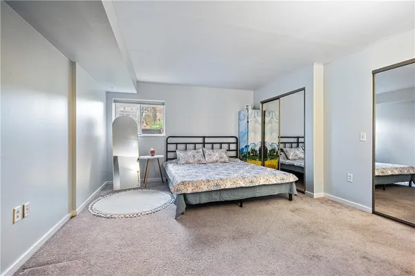 a view of a bedroom with closet and bathroom