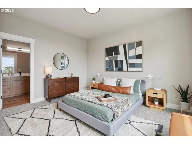 a living room with furniture rug and a mirror