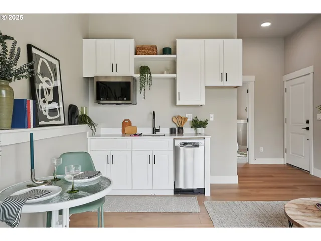 a kitchen with stainless steel appliances kitchen island granite countertop a sink and cabinets