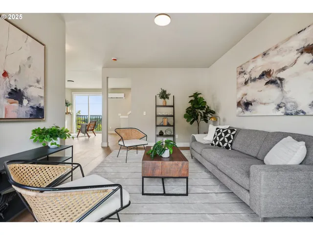 a living room with furniture and a rug
