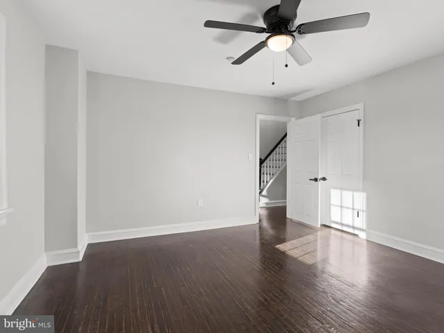a view of backyard with a deck and wooden floor