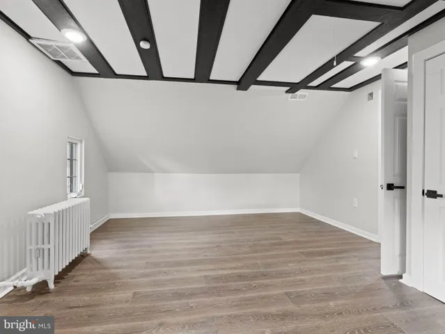 a view of an empty room with wooden roof