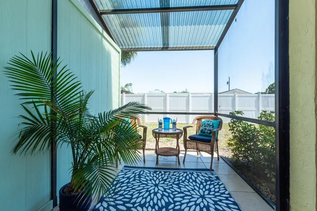 a dining room filled chandelier and wooden floor