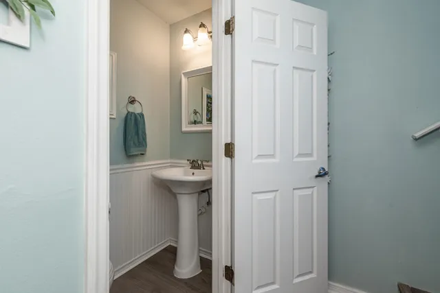 a view of entryway and hall with wooden floor