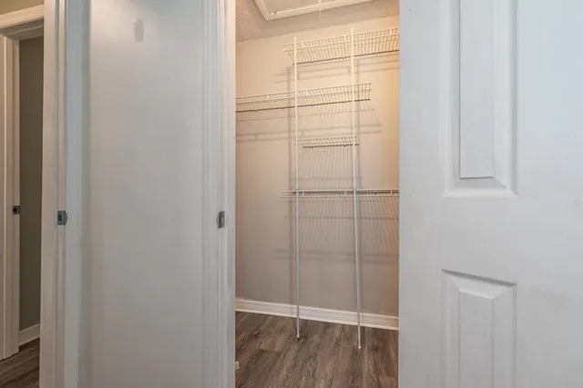 a bathroom with a toilet a sink and a mirror