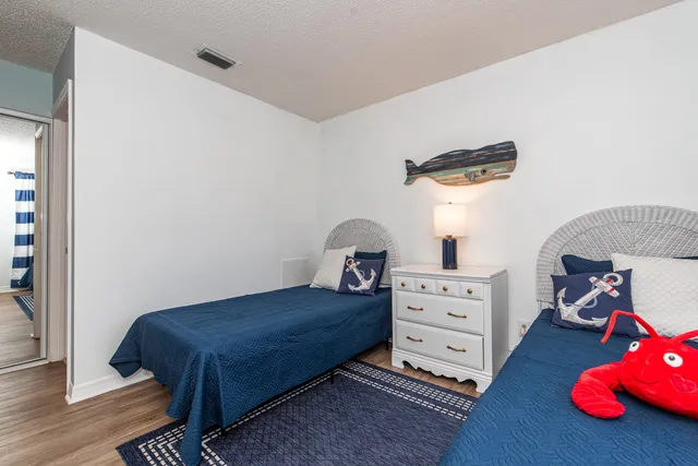 a bathroom with a sink a mirror a toilet and a mirror