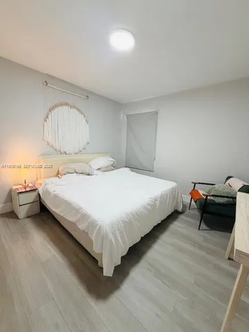 a bathroom with a toilet a sink and a mirror