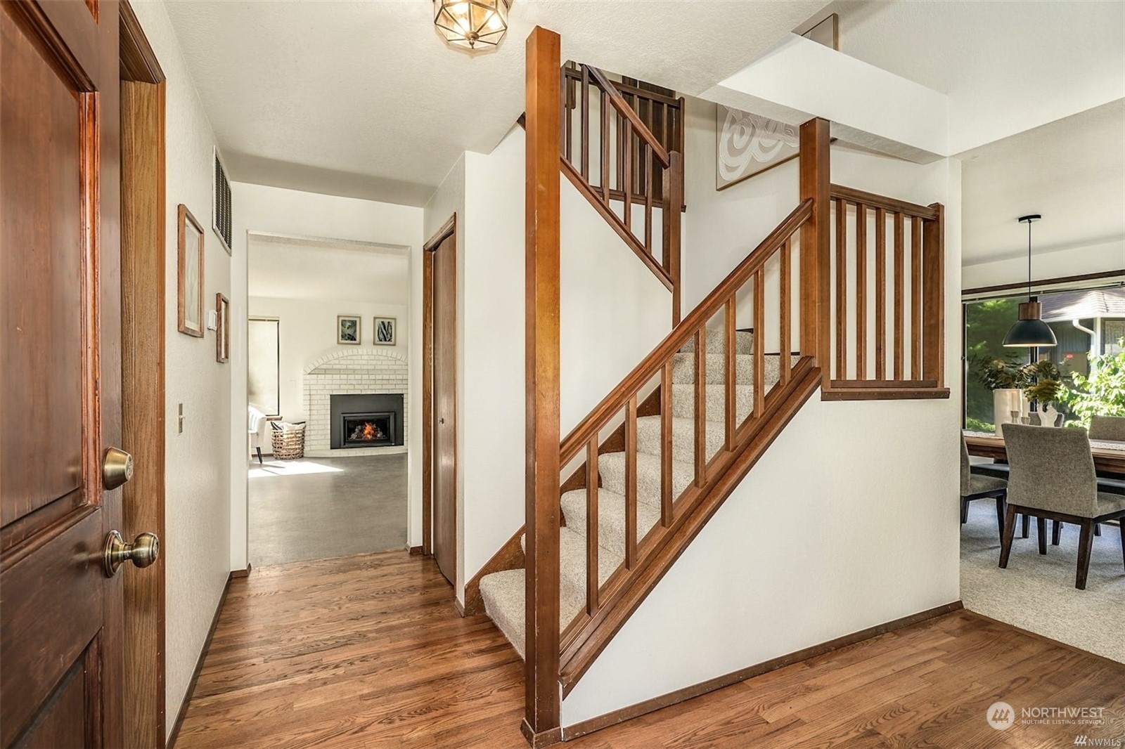 200 200th Place Southeast Bothell, WA 98012 - Photo 3 of 34 a view of a hallway with wooden floor and stairs