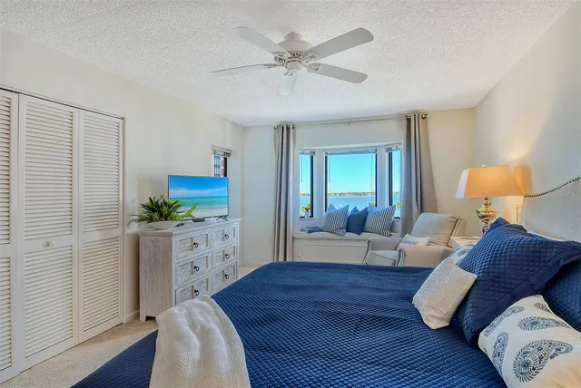 a bathroom with a granite countertop sink toilet a mirror a vanity and shower