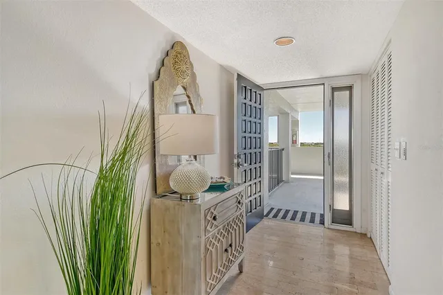 a backyard view with a seating space