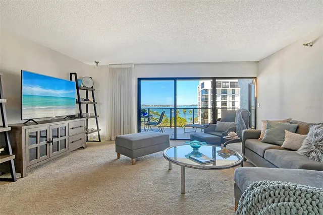 a view of a balcony with chairs and a table