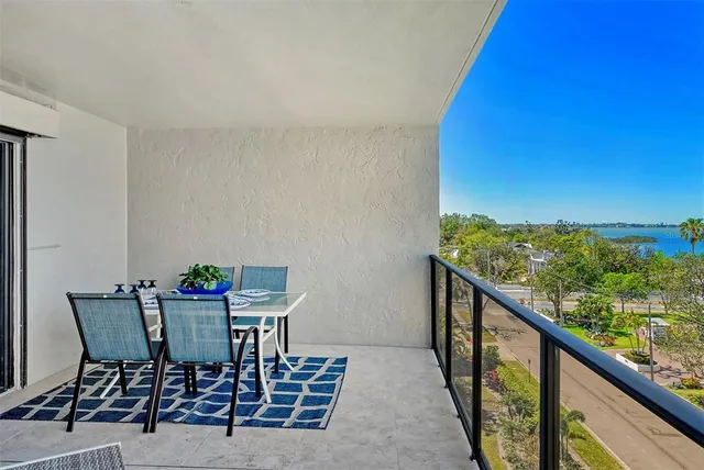 a view of a living room and a floor to ceiling window