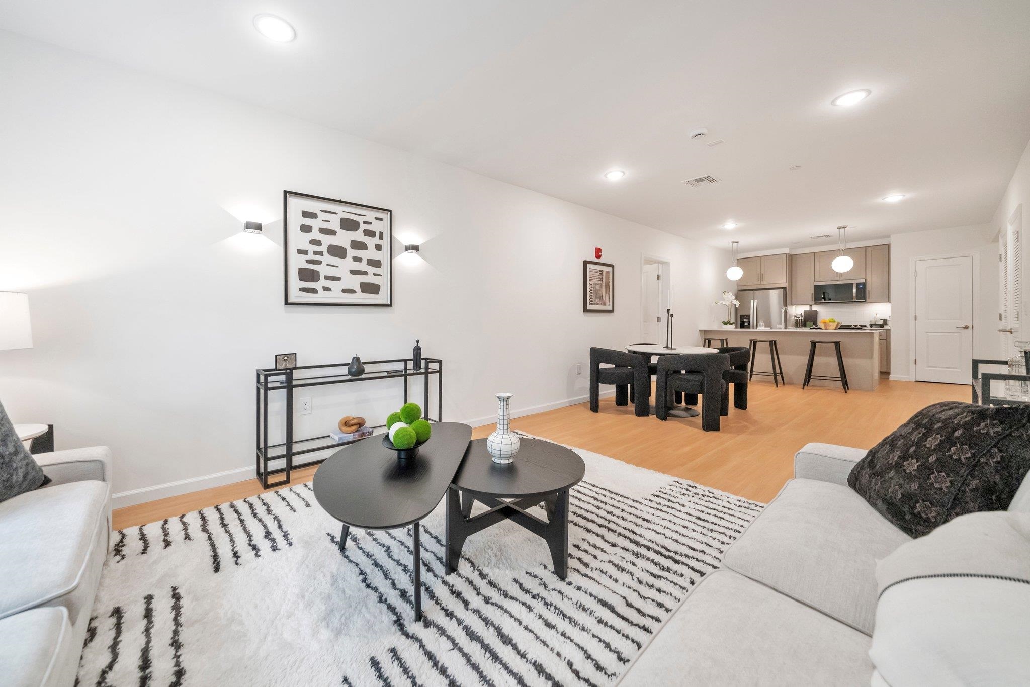 74 Ridgedale Avenue, Unit 304 Morristown, NJ 07960 - Photo 11 of 42 a living room with furniture and wooden floor