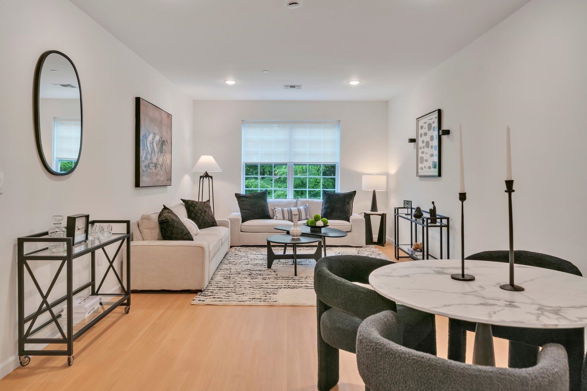 74 Ridgedale Avenue, Unit 304 Morristown, NJ 07960 - Photo 14 of 42 a living room with furniture a large window and a potted plant
