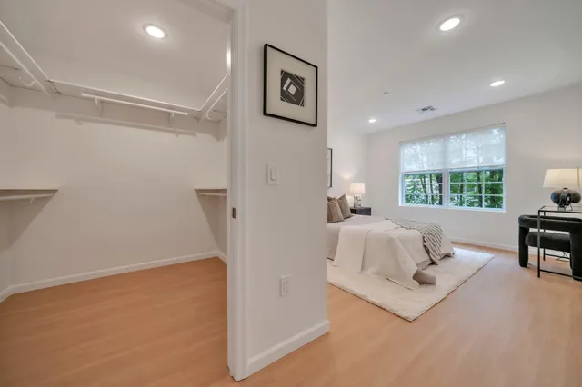 a bedroom with a bed and a table