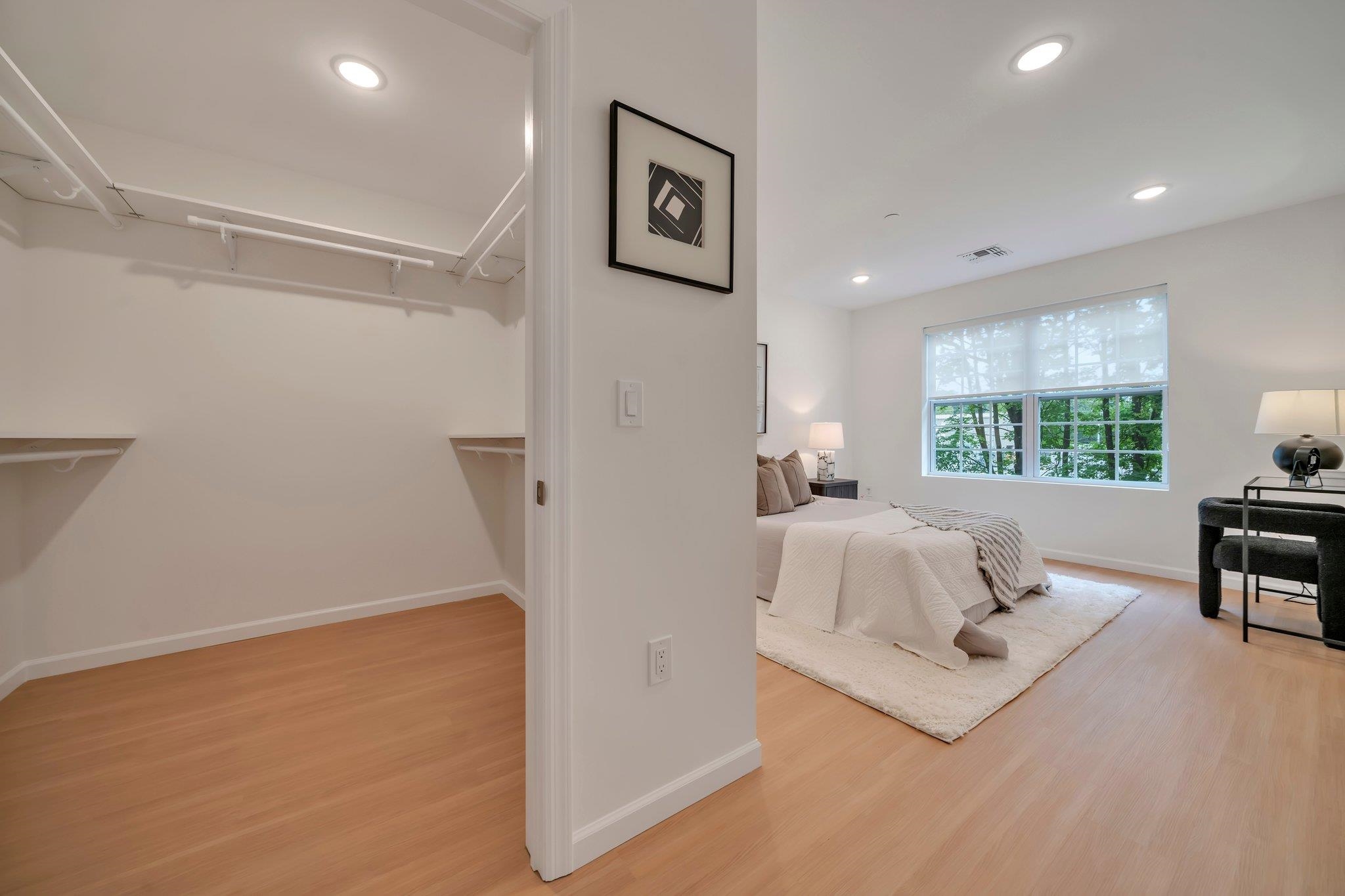 74 Ridgedale Avenue, Unit 304 Morristown, NJ 07960 - Photo 17 of 42 a bedroom with a bed and a table