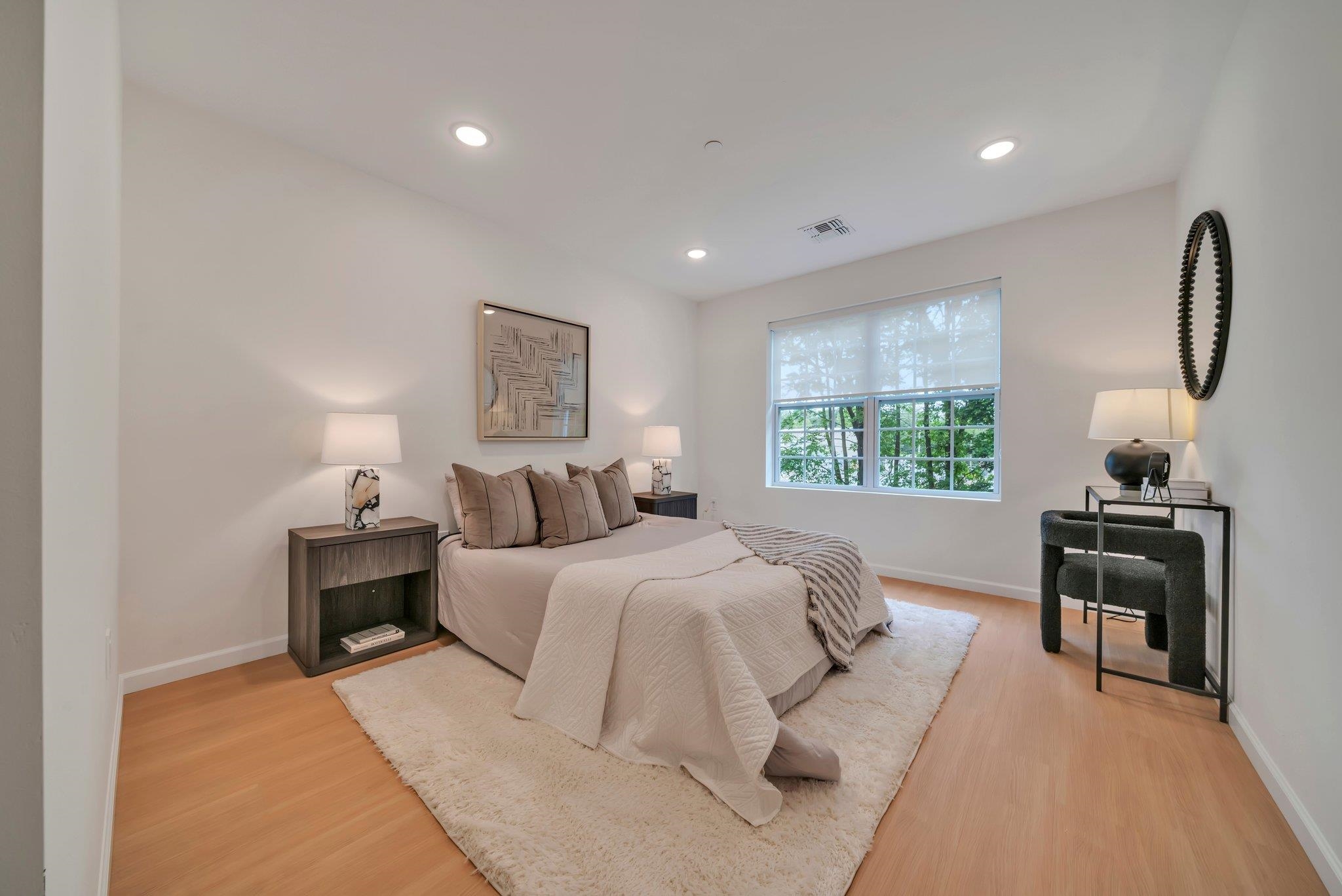 74 Ridgedale Avenue, Unit 304 Morristown, NJ 07960 - Photo 20 of 42 a bed room with a bed and a lamp