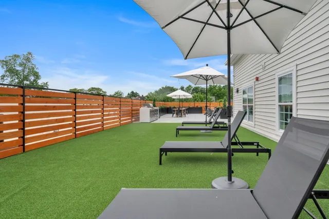 swimming pool view with a garden space