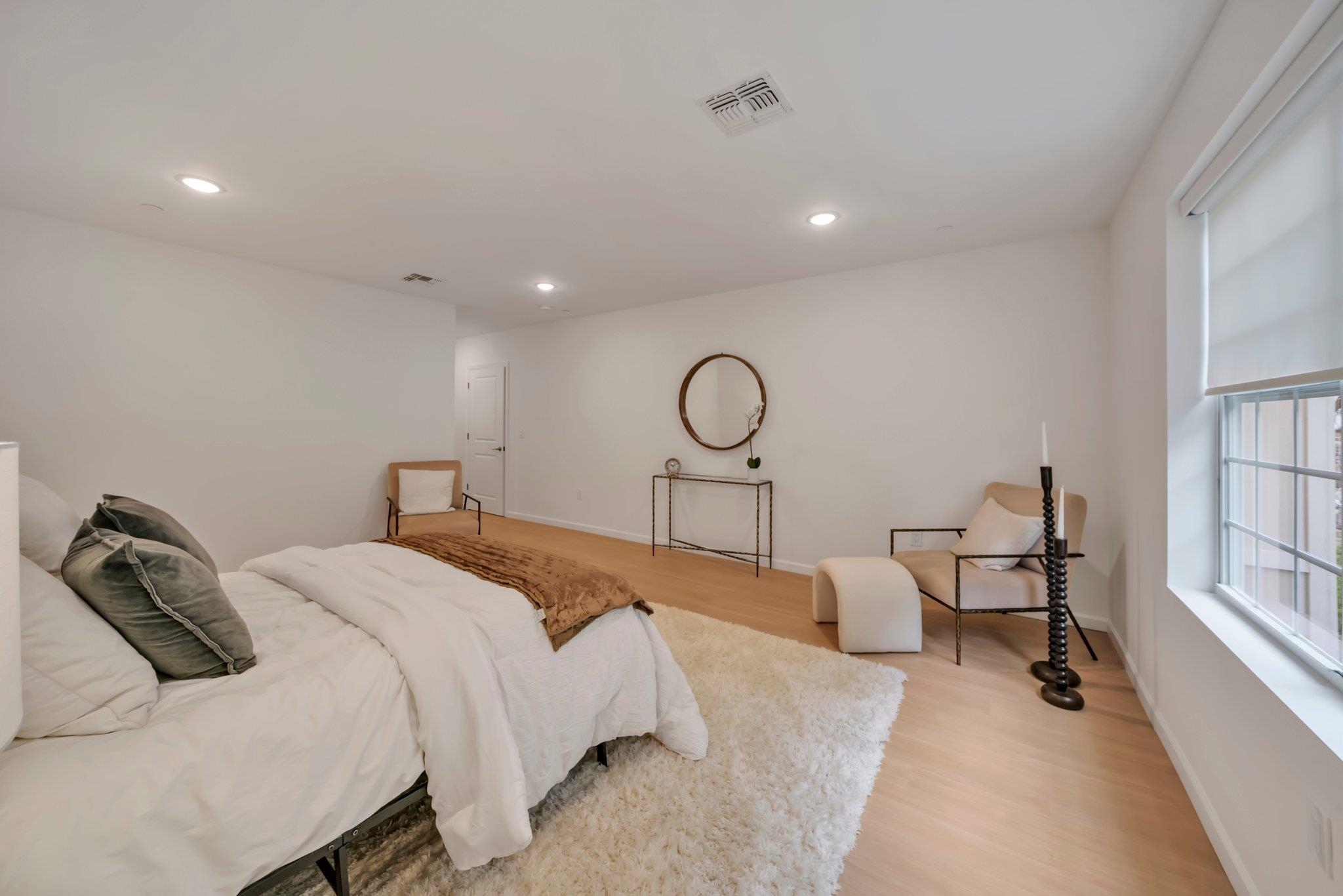 74 Ridgedale Avenue, Unit 304 Morristown, NJ 07960 - Photo 26 of 42 a bedroom with a bed and a chandelier