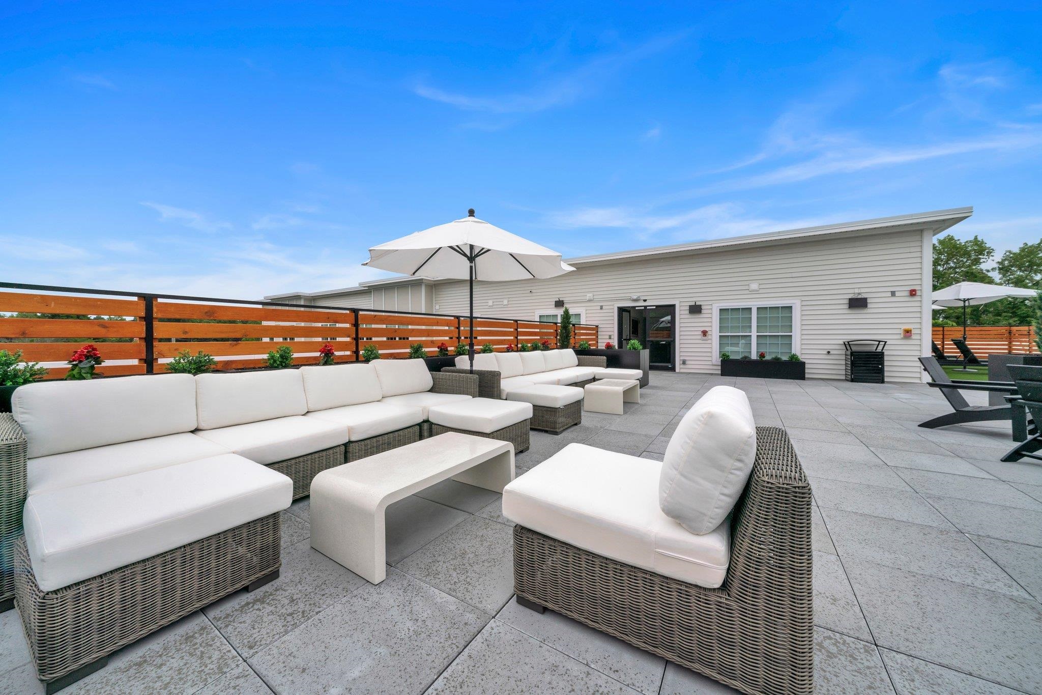 74 Ridgedale Avenue, Unit 304 Morristown, NJ 07960 - Photo 3 of 42 a outdoor living space with furniture and an umbrella