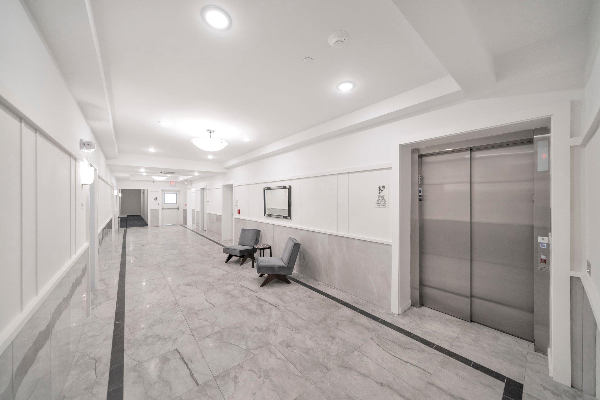 74 Ridgedale Avenue, Unit 304 Morristown, NJ 07960 - Photo 34 of 42 a view of a hallway to a room with view of a bathroom