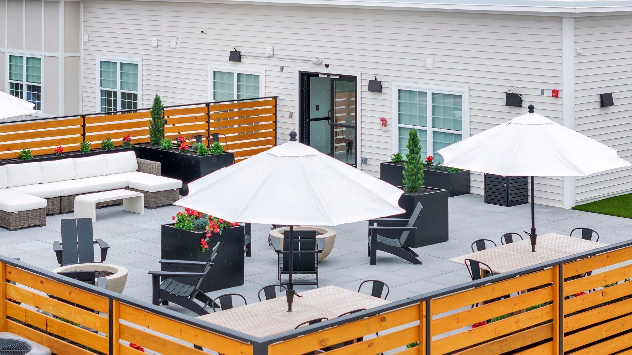 74 Ridgedale Avenue, Unit 304 Morristown, NJ 07960 - Photo 7 of 42 a view of a kitchen with a table and chairs