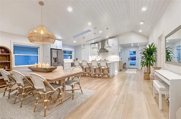 a large kitchen with a table and chairs