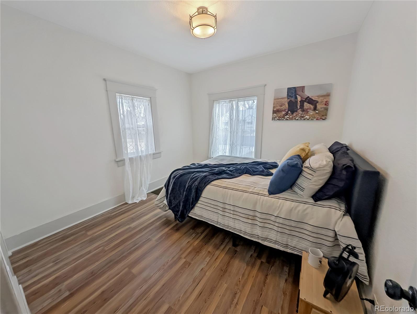 710 Carson Street Brush, CO 80723 - Photo 11 of 30 a bedroom with a bed and a window