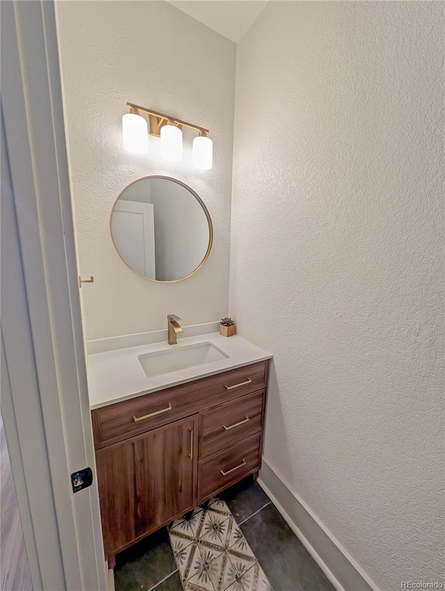 710 Carson Street Brush, CO 80723 - Photo 18 of 30 a bathroom with a sink and a mirror