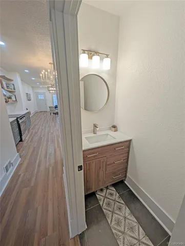 a bathroom with a vanity mirror and sink