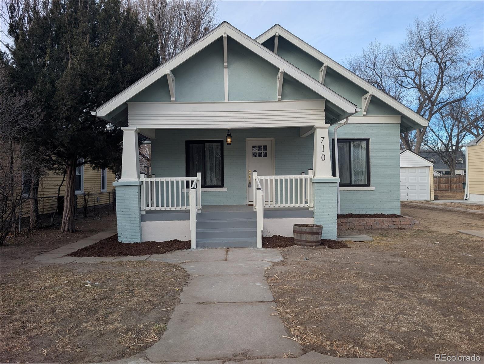 710 Carson Street Brush, CO 80723 - Photo 2 of 30 a front view of a house with a yard