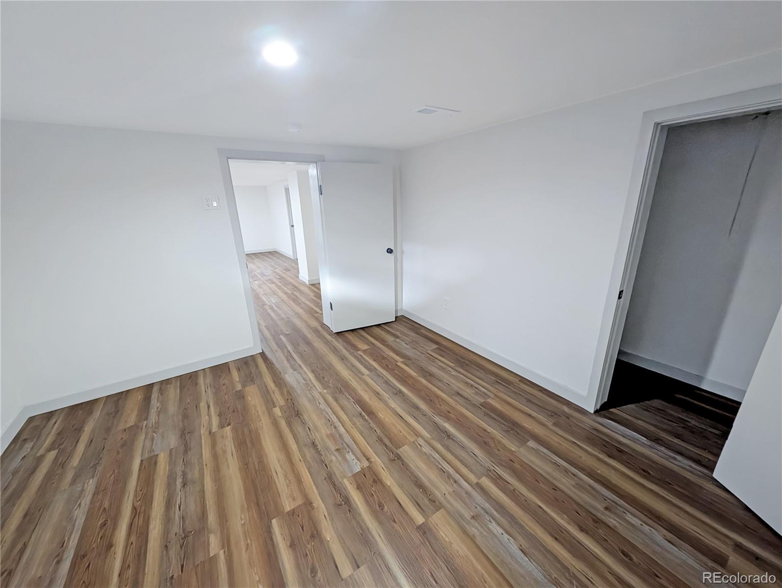 710 Carson Street Brush, CO 80723 - Photo 23 of 30 a view of wooden floor in an empty room