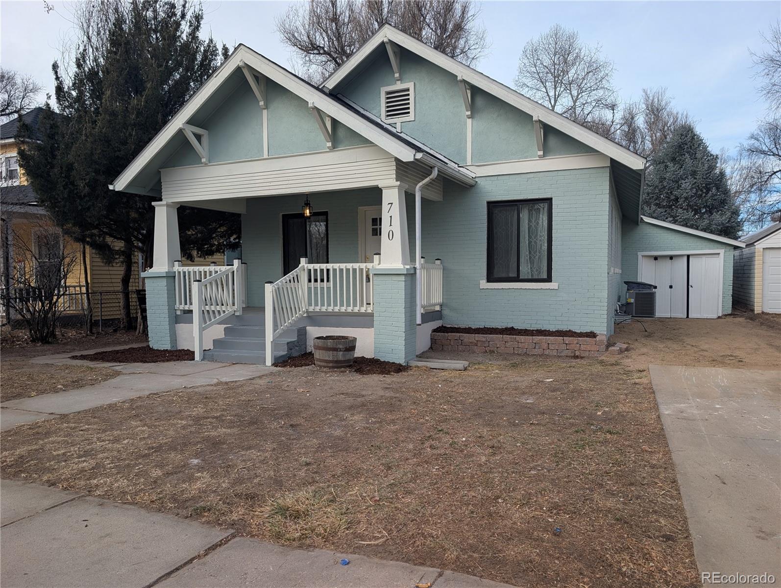 710 Carson Street Brush, CO 80723 - Photo 26 of 30 a view of a house with a yard and large tree