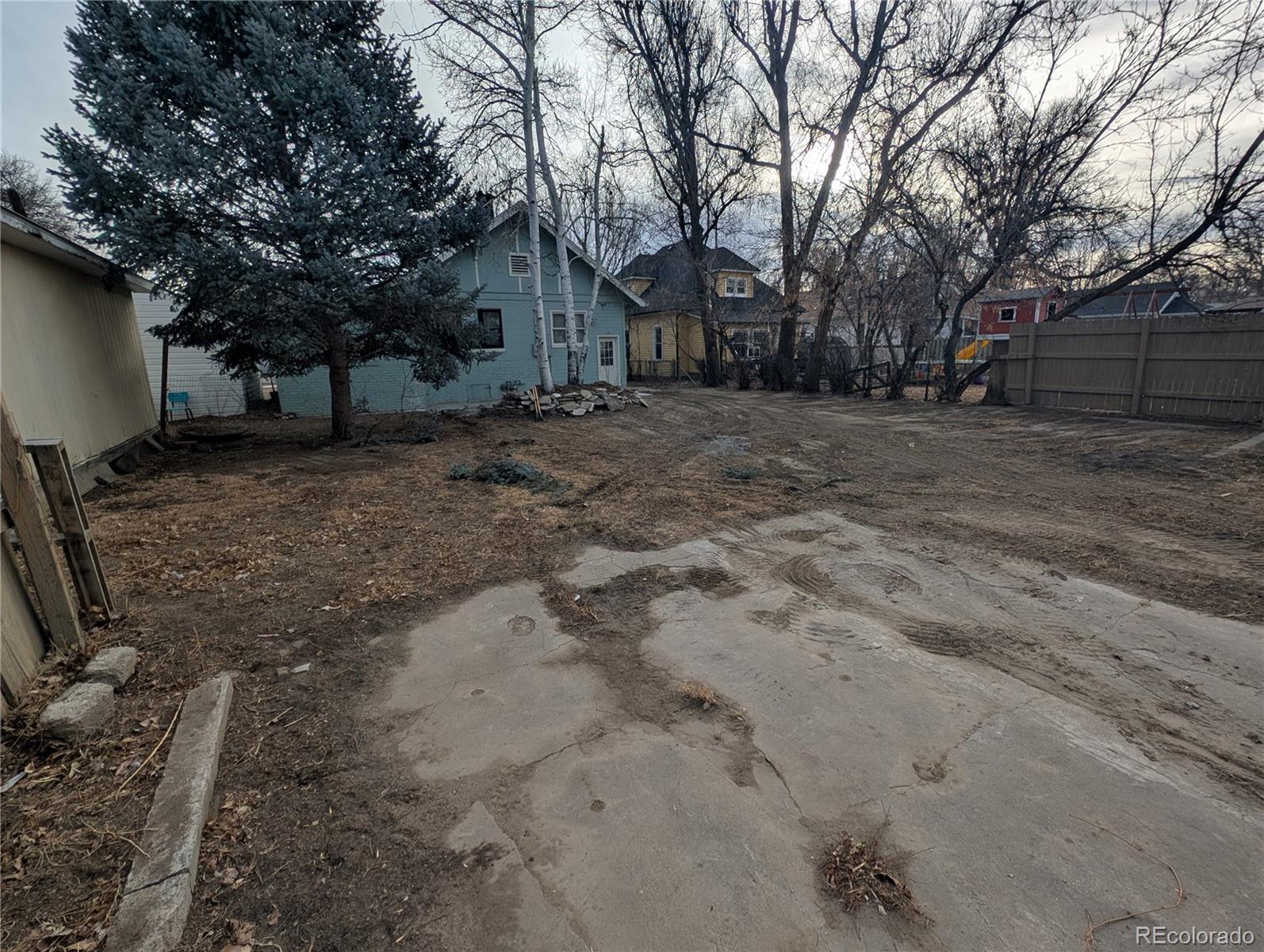 710 Carson Street Brush, CO 80723 - Photo 29 of 30 a view of a yard with large trees