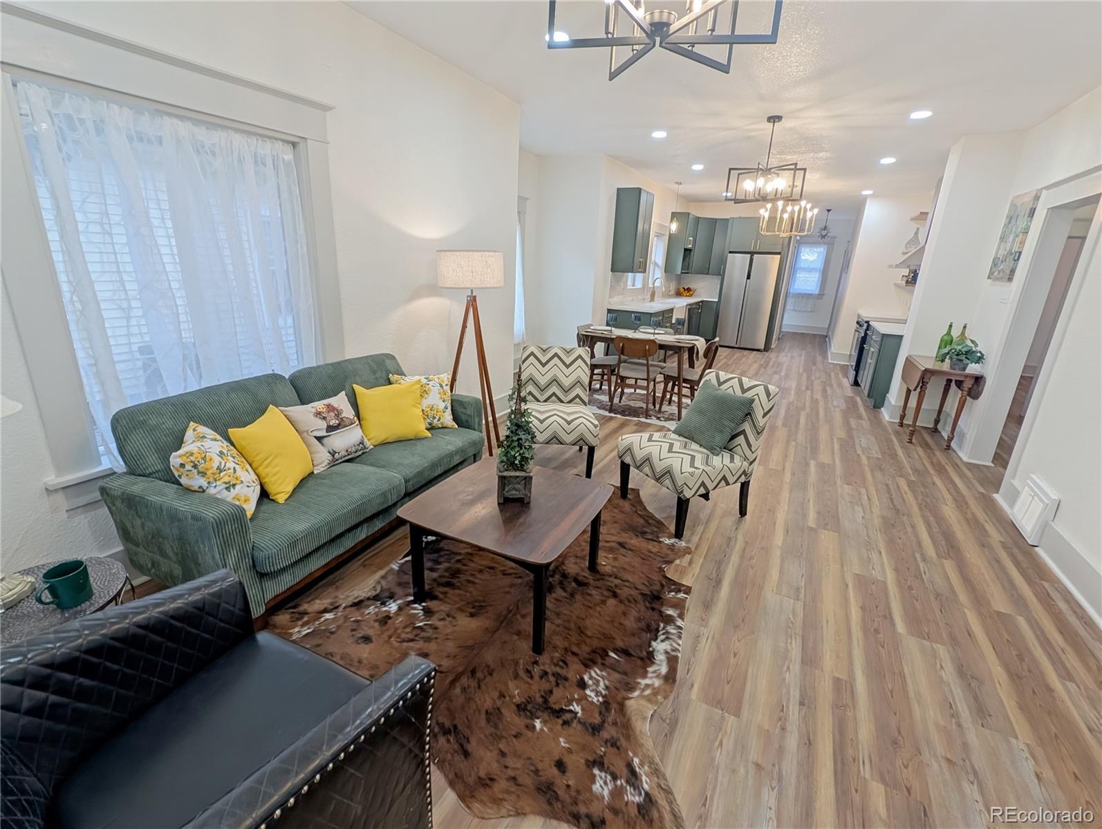 710 Carson Street Brush, CO 80723 - Photo 8 of 30 a living room with furniture and a wooden floor