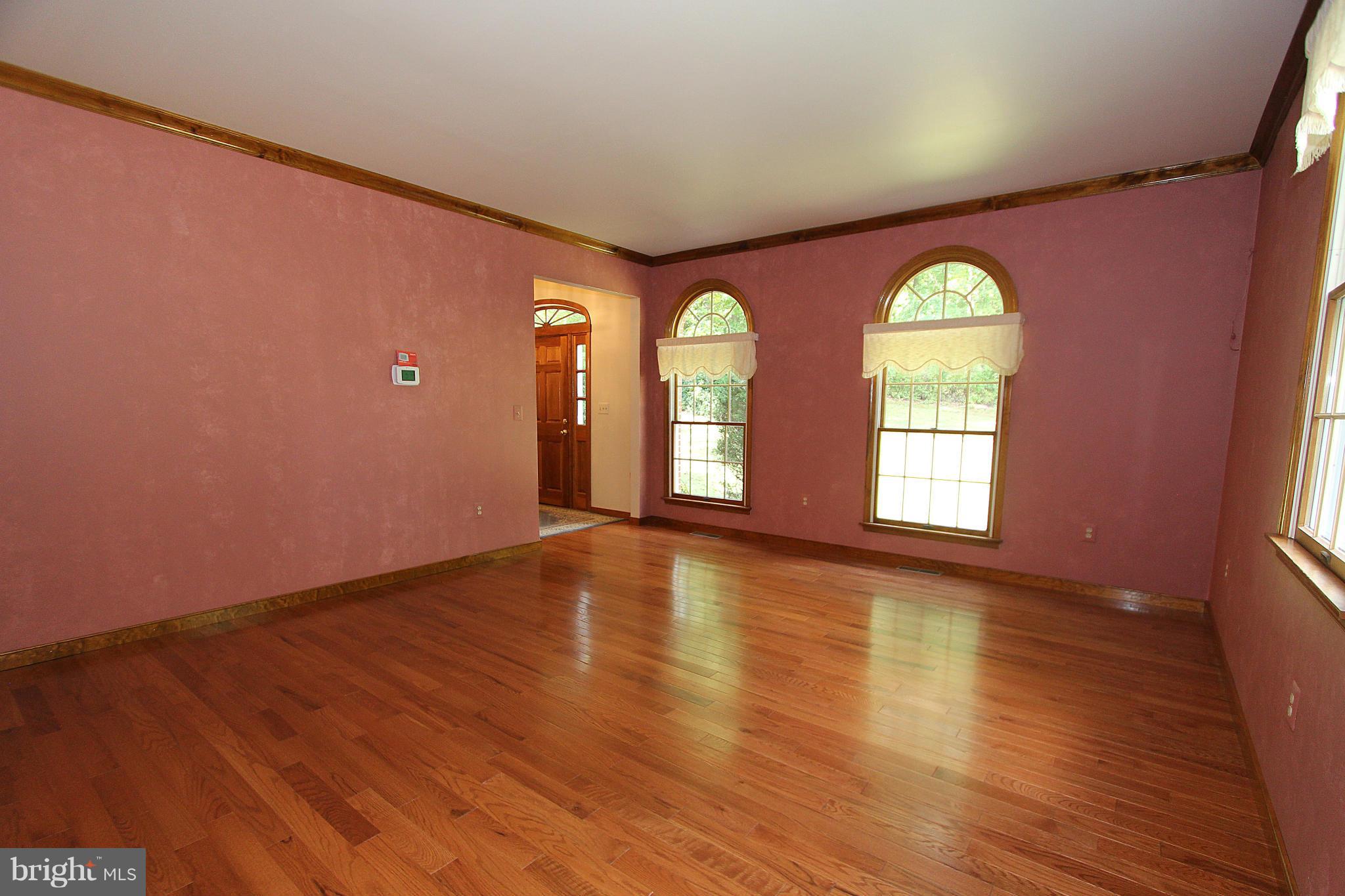 3154 Charles Street Fallston, MD 21047 - Photo 14 of 30 an empty room with wooden floor and windows