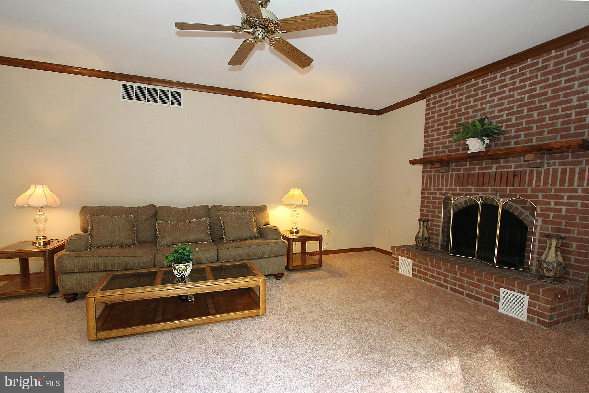 3154 Charles Street Fallston, MD 21047 - Photo 6 of 30 a living room with furniture and a fireplace