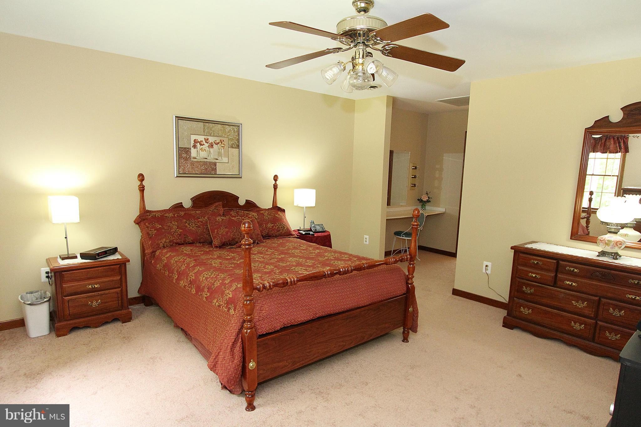 3154 Charles Street Fallston, MD 21047 - Photo 7 of 30 a bedroom with a bed and dresser