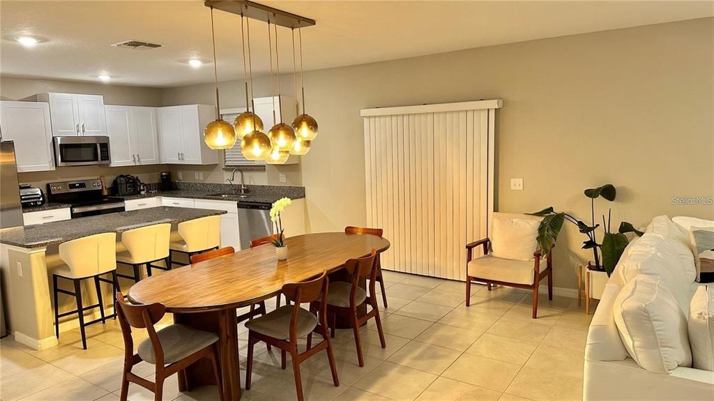 31363 Sun Kettle Loop Wesley Chapel, FL 33545 - Photo 14 of 29 a kitchen with a table and chairs in it