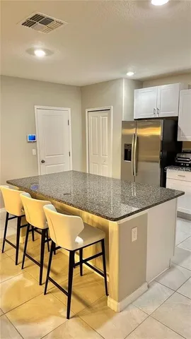 a kitchen with granite countertop sink cabinets and granite counter top