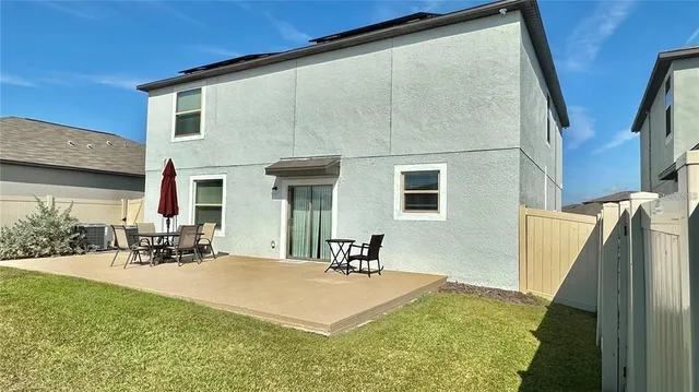 a front view of a house with yard and seating area