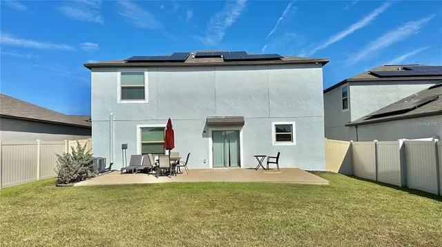 a view of swimming pool with outdoor seating
