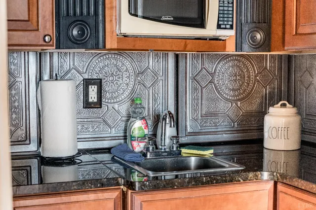 a roof deck with table and chairs and wooden floor