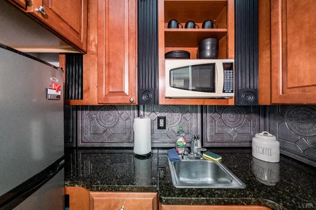 a view of a balcony with wooden floor and iron stairs