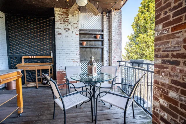 a bedroom with a bed and a lamp