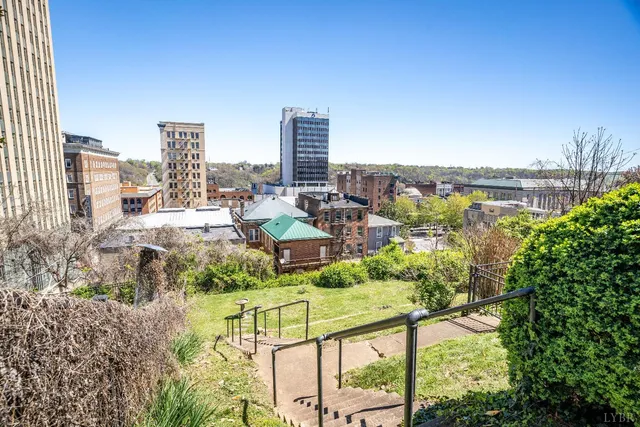 a kitchen with granite countertop stainless steel appliances a sink and a window
