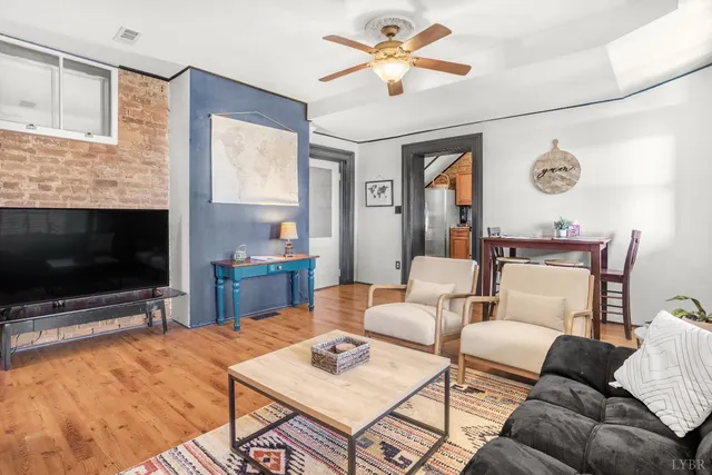 a bathroom with a toilet and a shower curtain