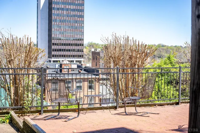 a bathroom with a toilet and a shower curtain